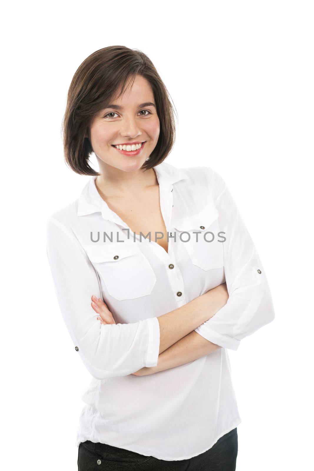 Portrait of a young brunette smiling, with her arms crossed, isolated on white