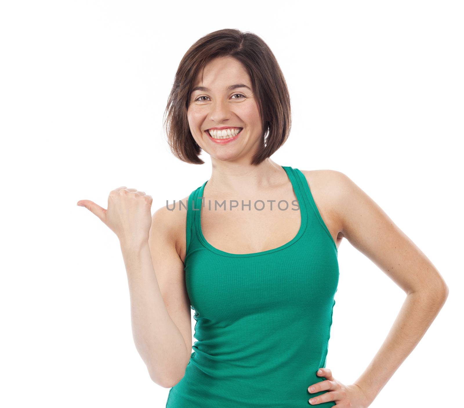 Pretty woman pointing up with her thumb, isolated on white 