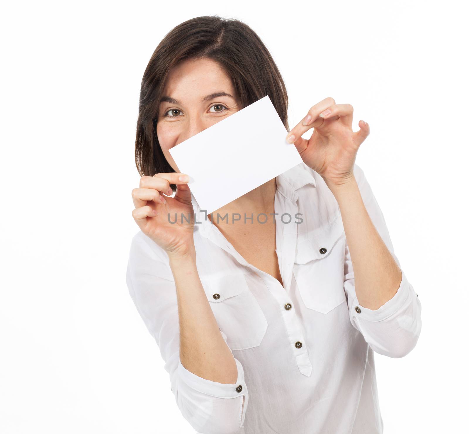 Young brunette presenting a white signboard, isolated on white