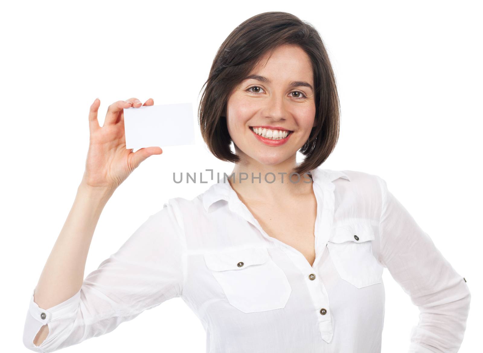 Pretty young brunette presenting a blank business card, isolated on white