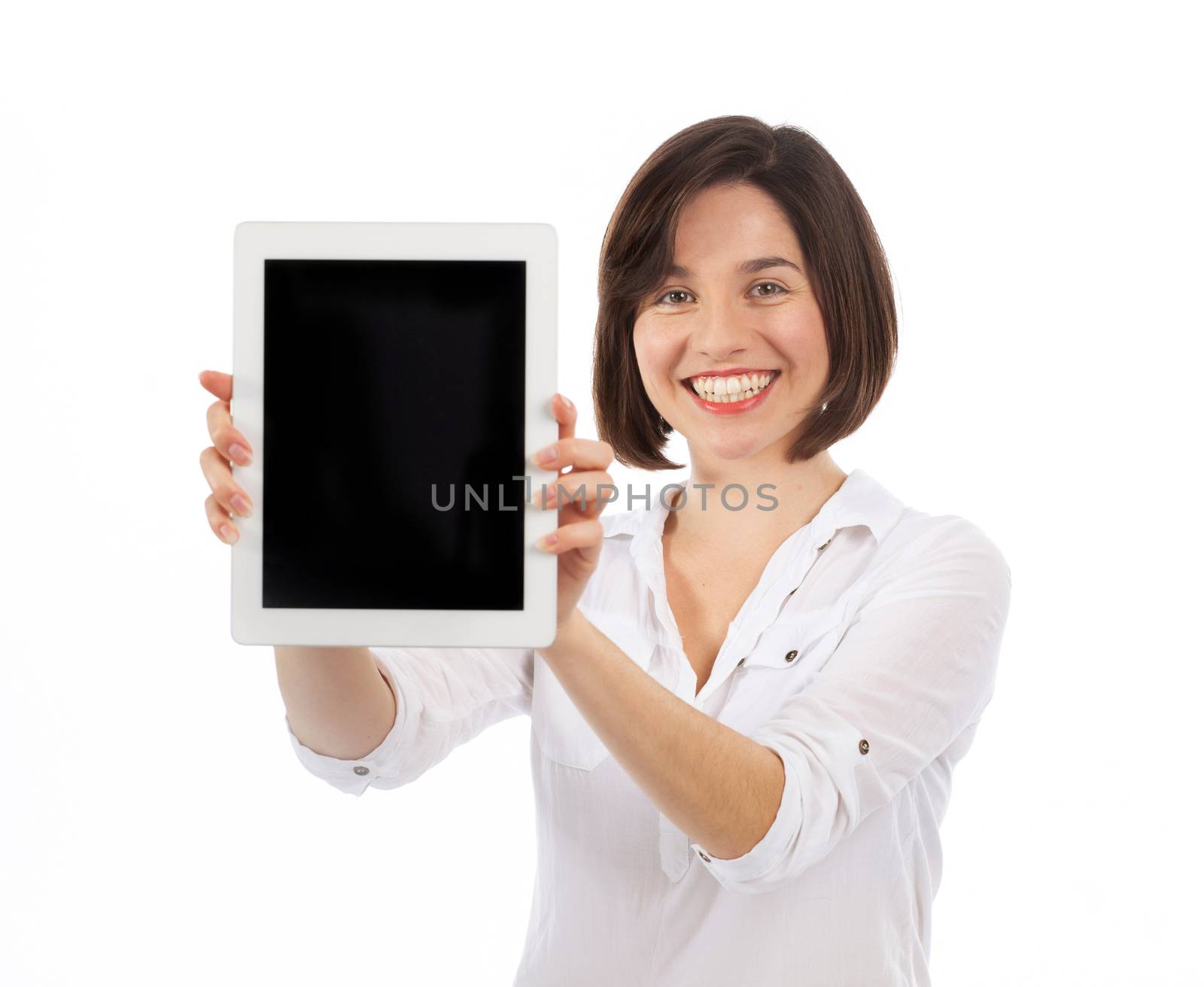 Smiling woman holding and showing a blank touchpad, communication concept, isolated on white