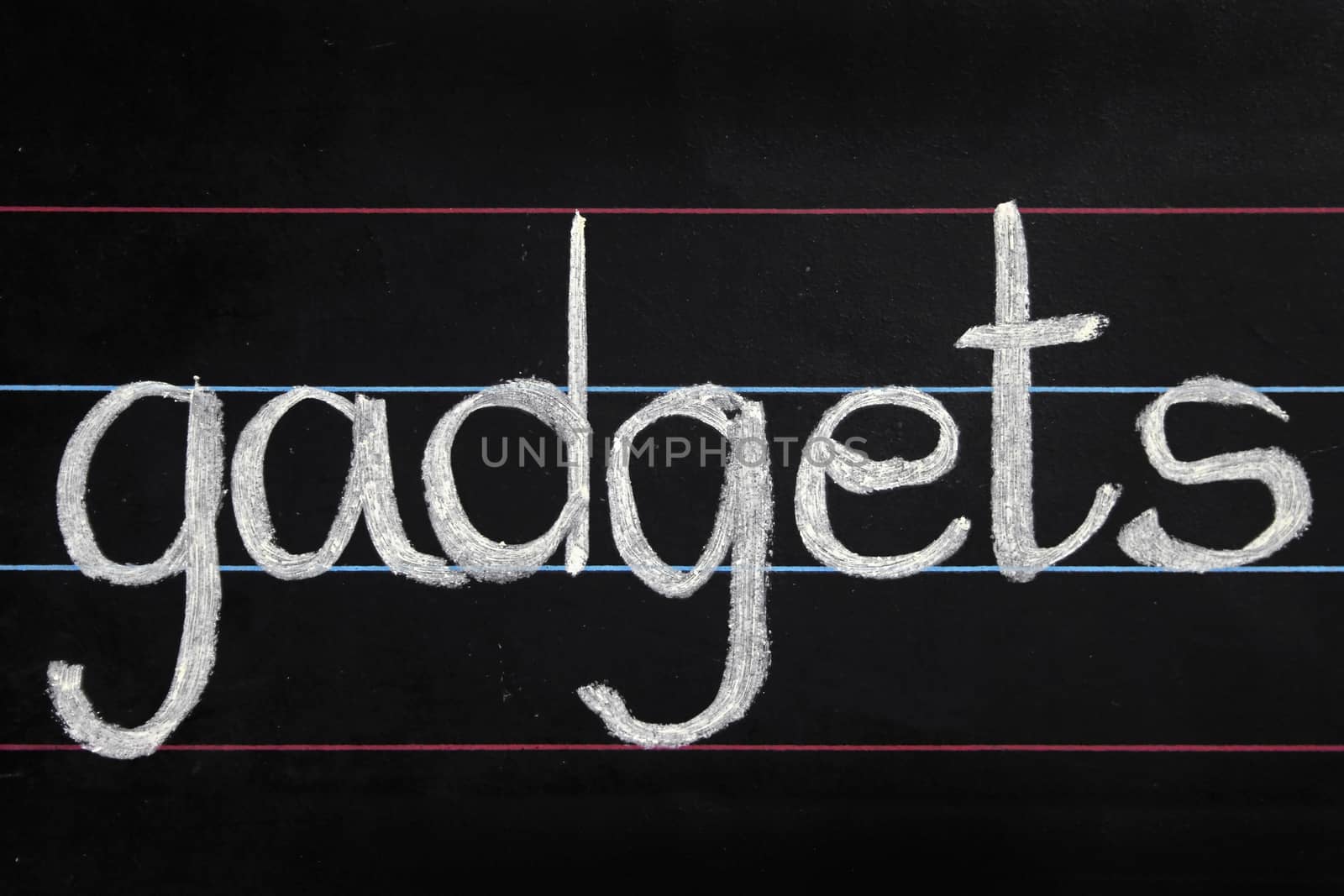 gadgets phrase handwritten on blackboard by yands