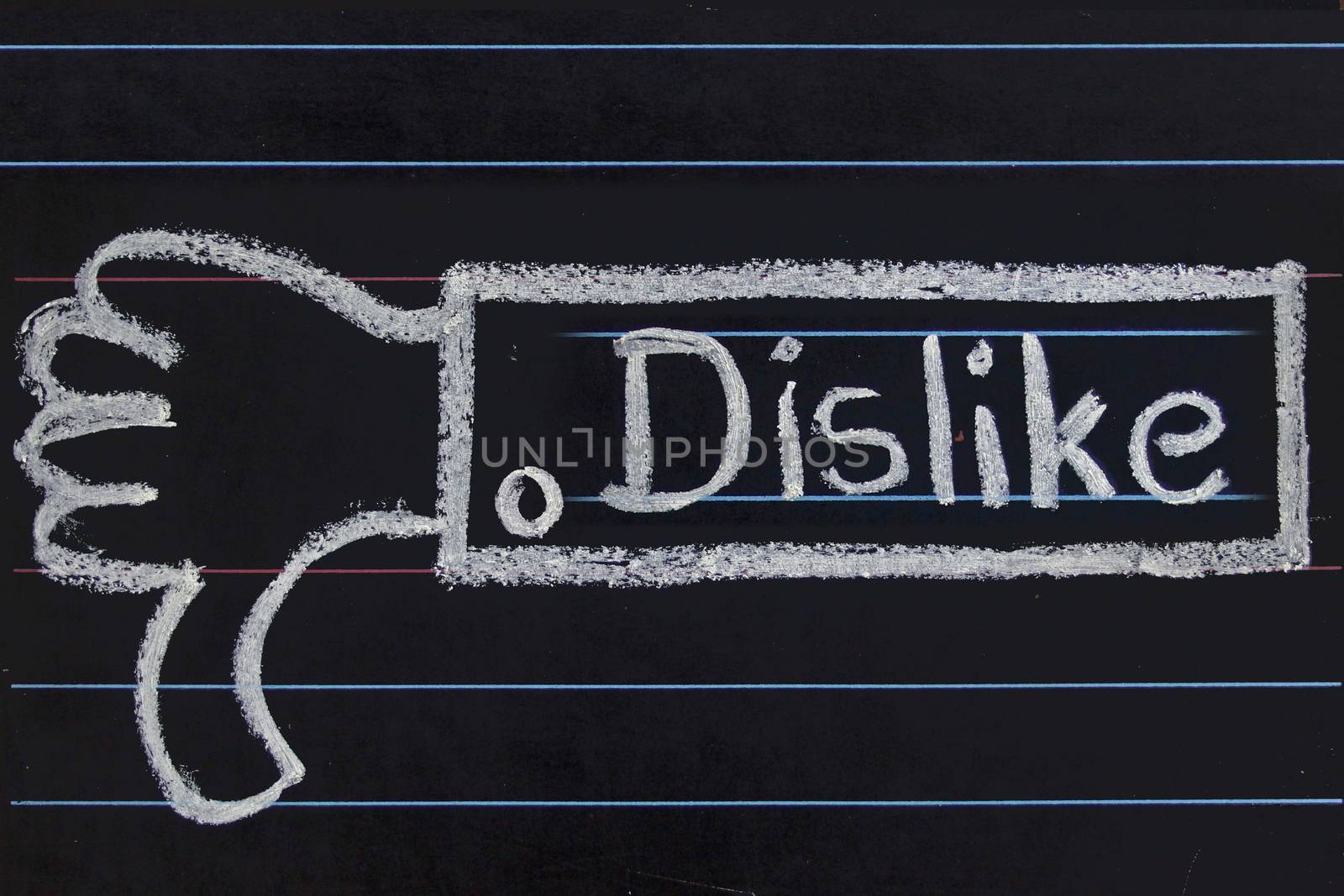 Dislike word handwritten on black chalkboard