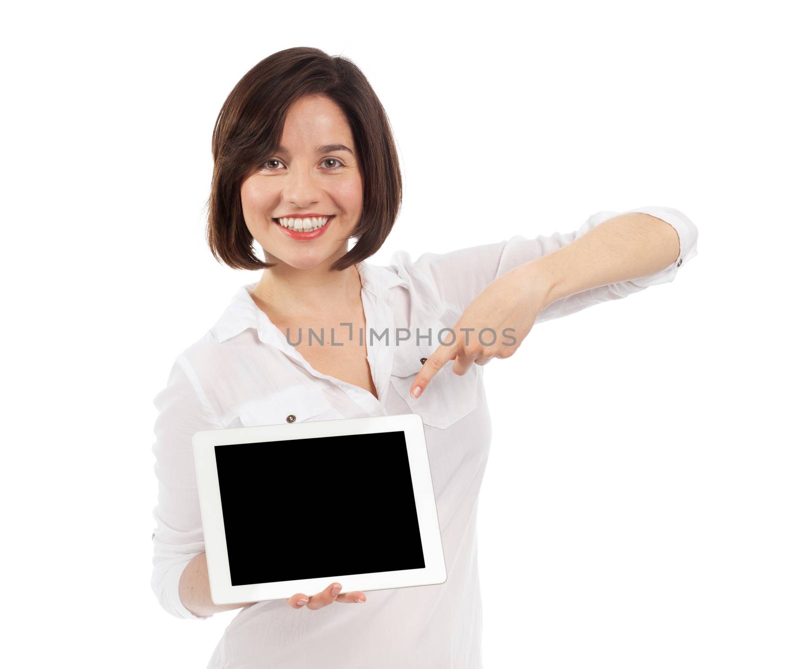 Smiling brunette showing a blank touchpad with her finger, communication concept, isolated on white