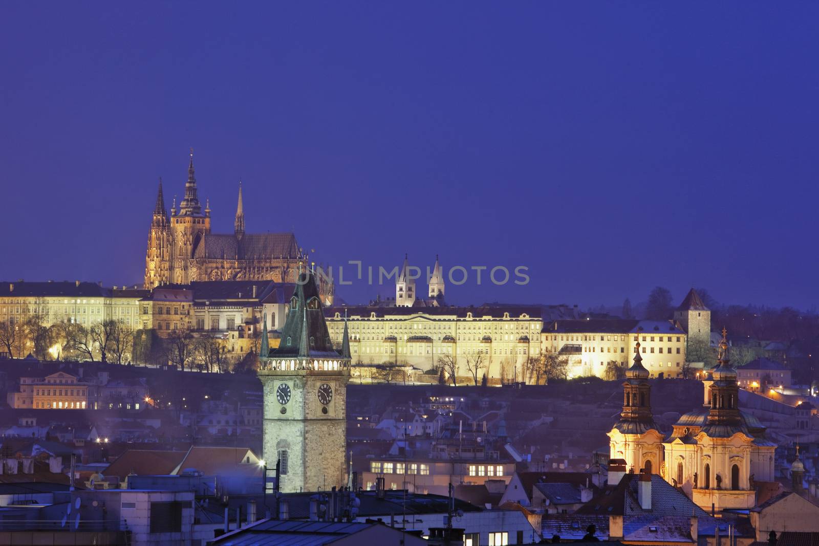prague - spires of the old town and hradcany castle at dusk