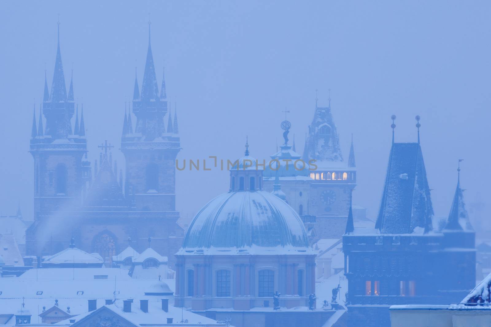 prague - spires of the old town during heavy snowfall