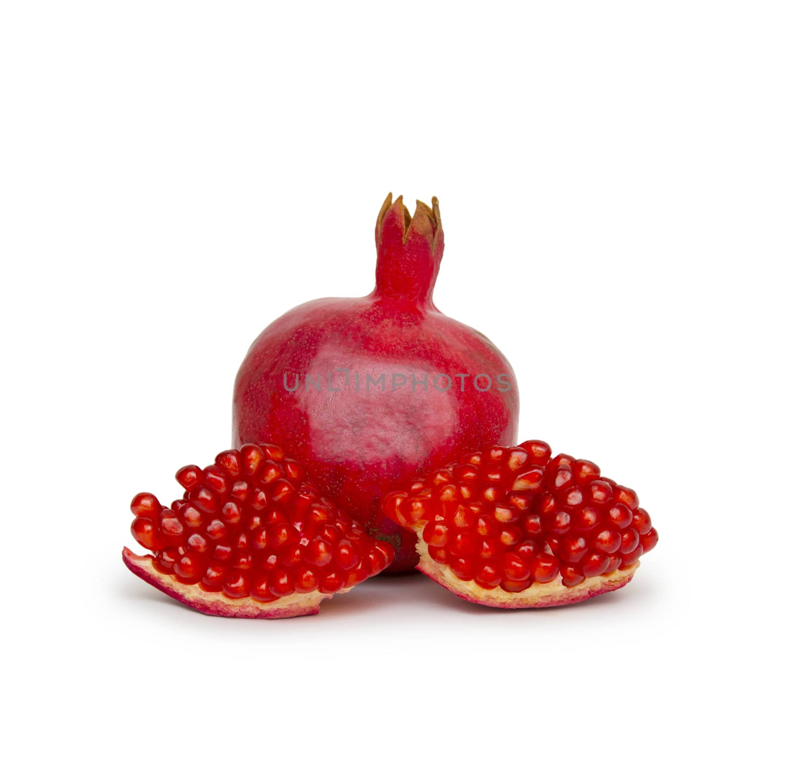 Ripe pomegranate fruit isolated on white background cutout