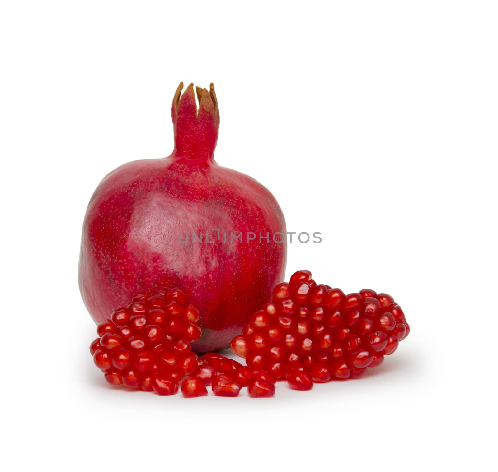 Ripe pomegranate fruit isolated on white background cutout by cocoo