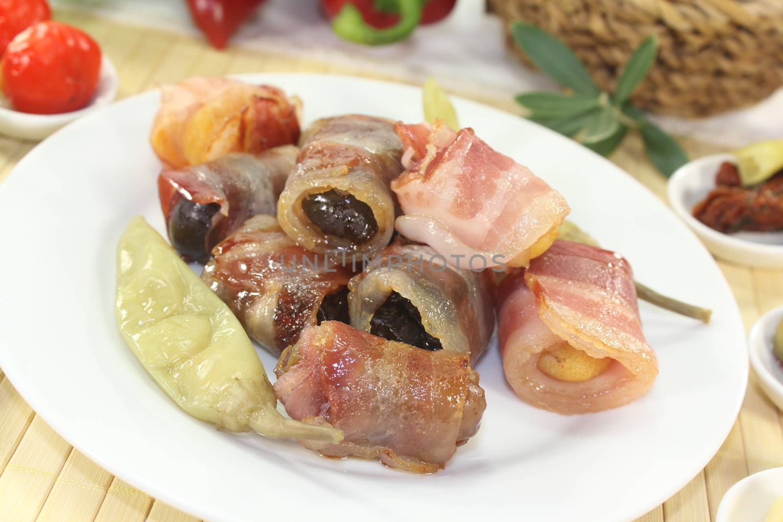 Tapas with prunes, figs, apricots and bacon