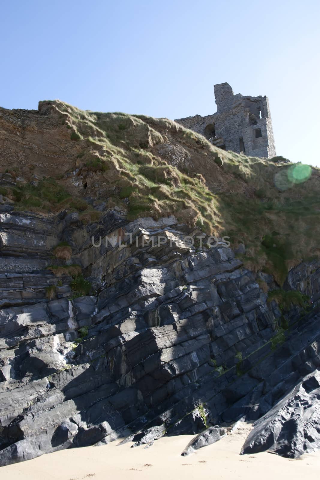 old historic castle on a cliff edge by morrbyte