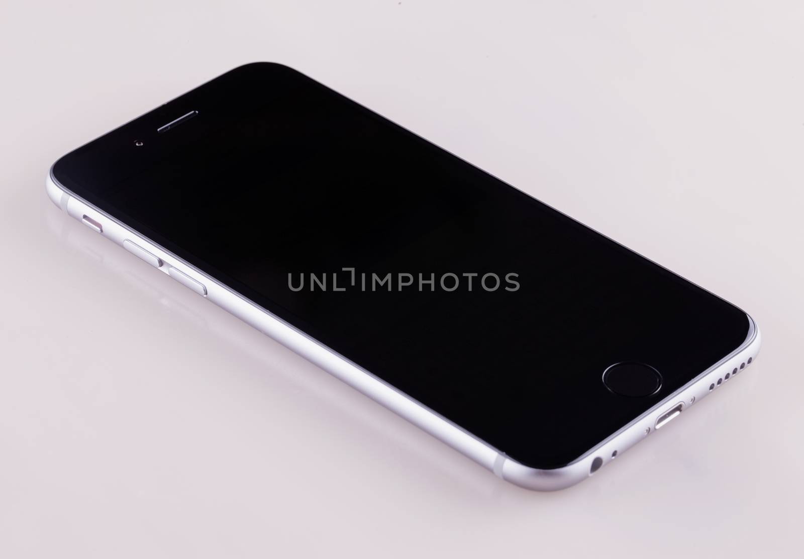 CASALE MONFERRATO, ITALY - NOVEMBER 28, 2014: Apple iPhone 6, front view, lying on white background. iPhone 6 is the latest model of successful dynasty of smartphones