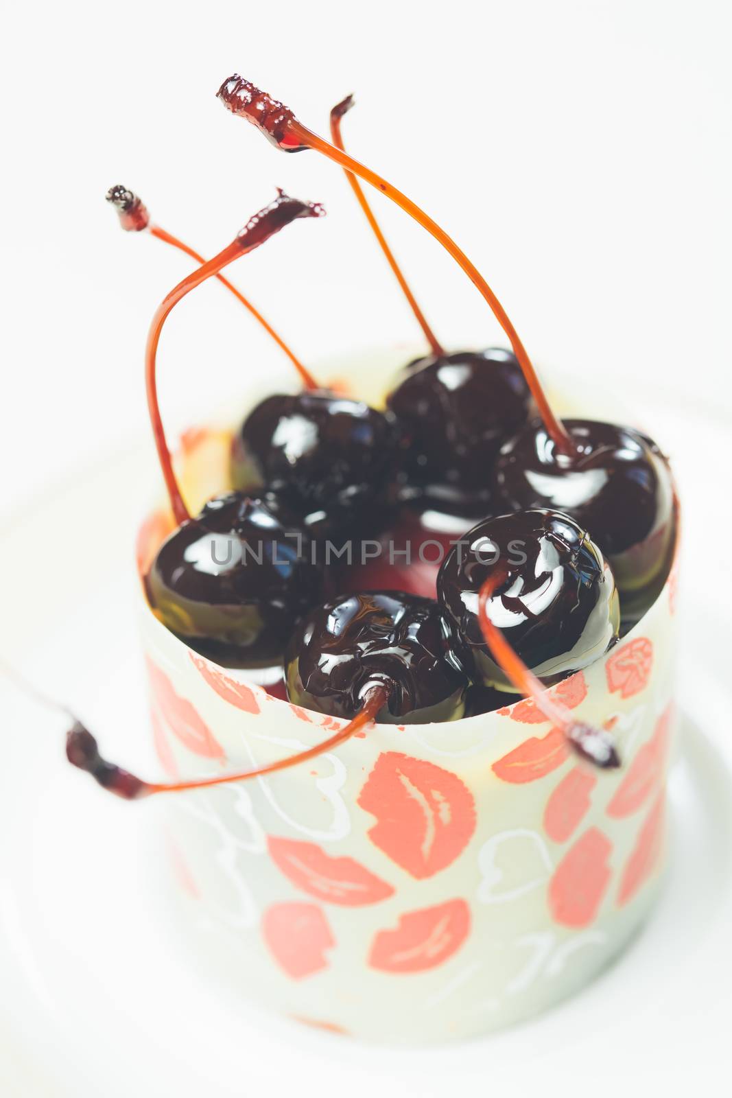 vanilla dessert with cherry confiture. Warm colors. Shallow dof. 