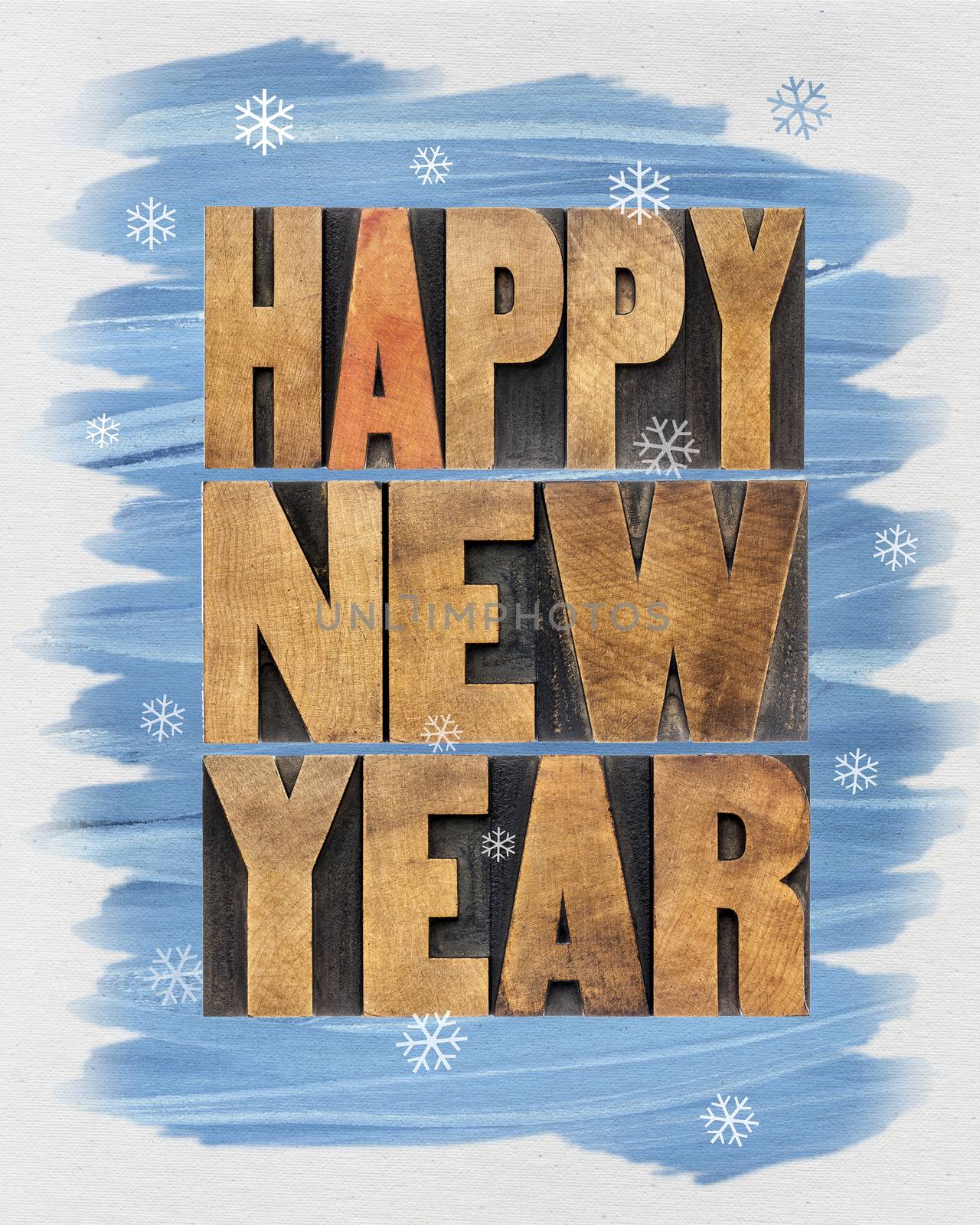 Happy New Year greetings or wishes - a collage of  text in vintage letterpress wood type blocks and watercolor painting on canvas