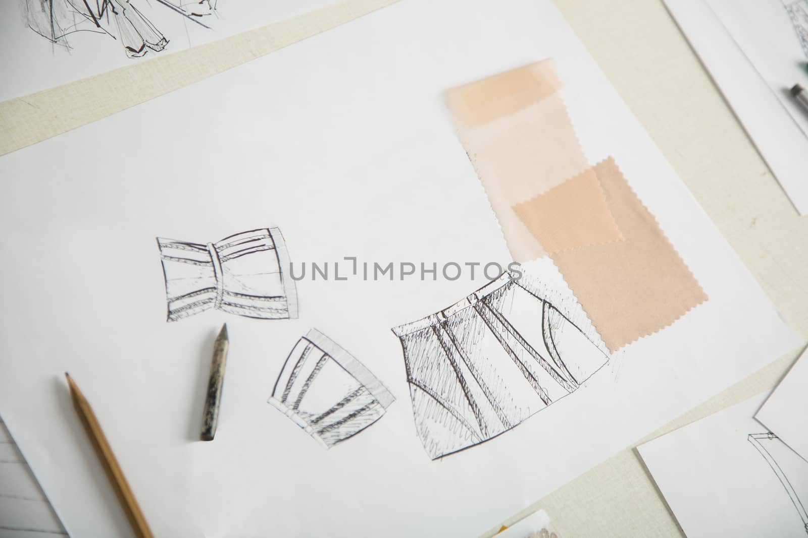 fashion designers, working in progress on tailor table