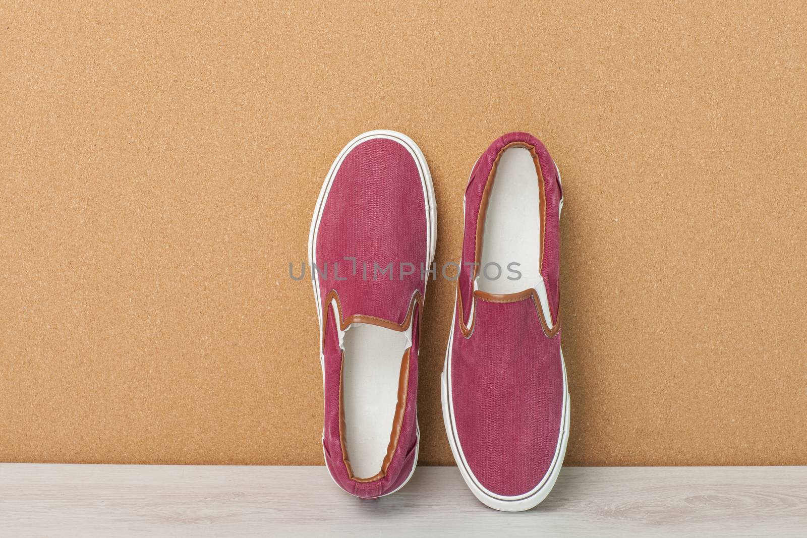 Red Sneaker on a Wood Background, slip-on shoes