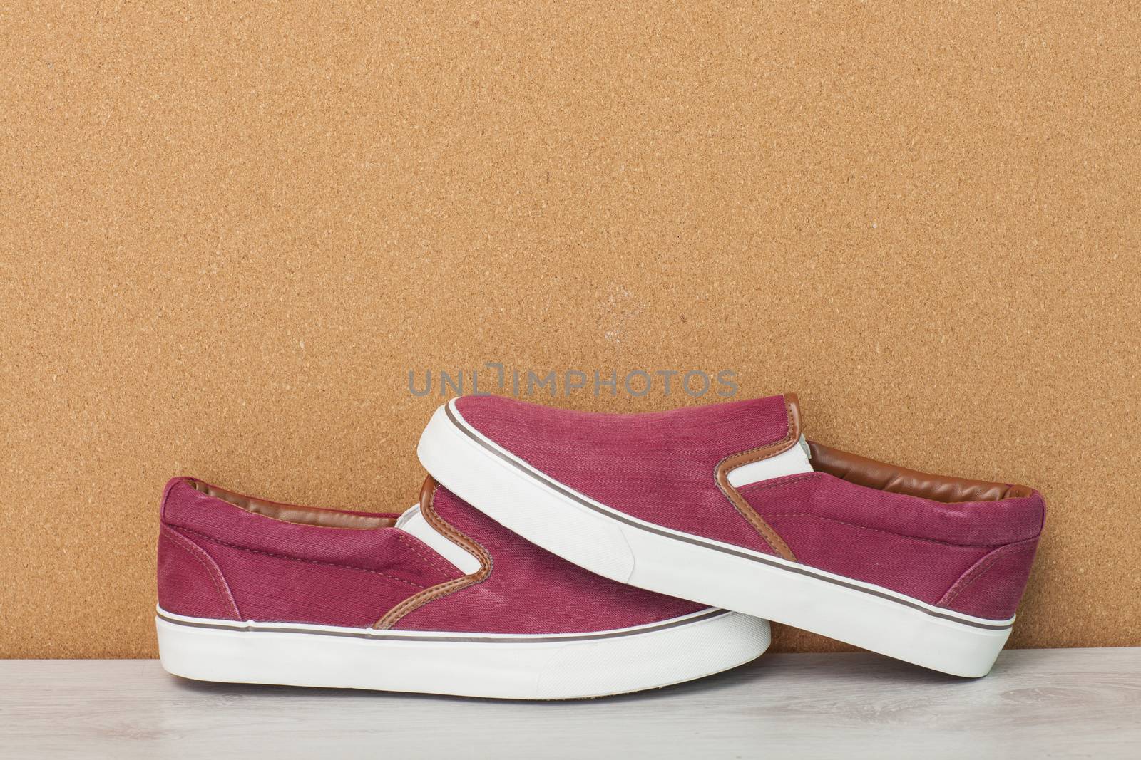 Red Sneaker on a Wood Background, slip-on shoes