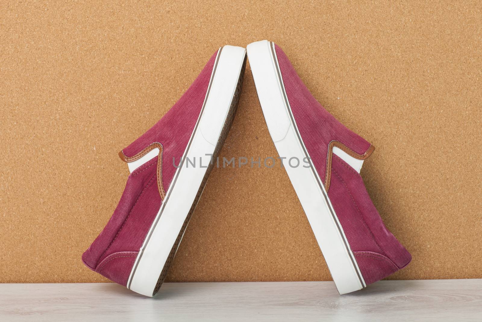 Red Sneaker on a Wood Background, slip-on shoes