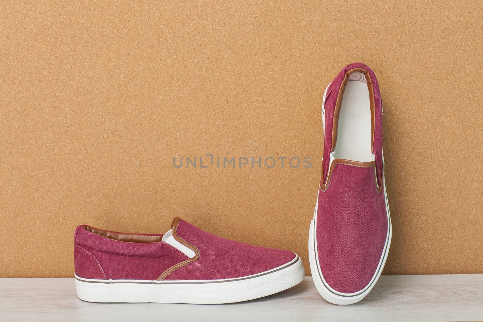 Red Sneaker on a Wood Background, slip-on shoes