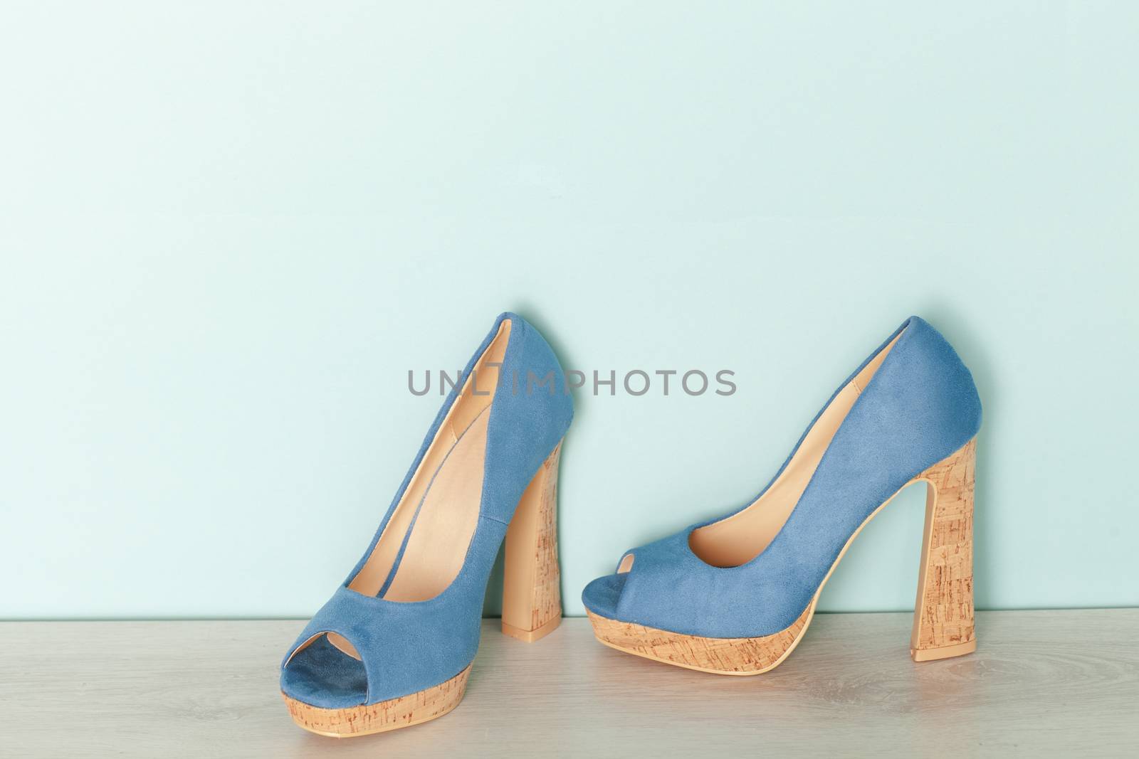 Fashionable Peeptoe High Heels on blue background