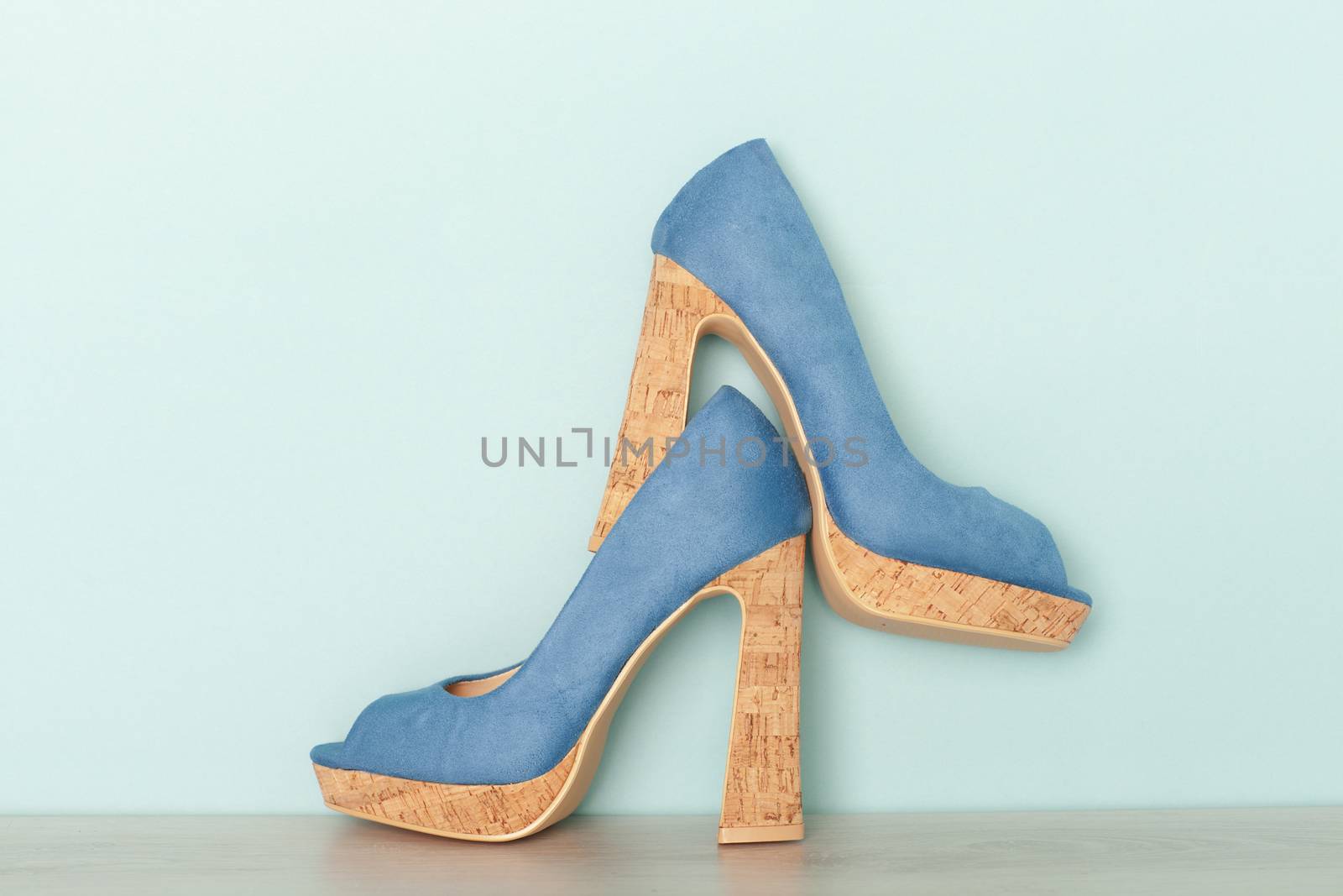 Fashionable Peeptoe High Heels on blue background