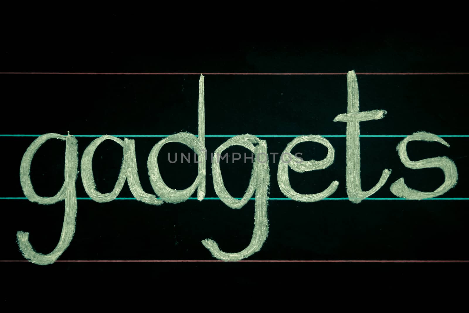 gadgets phrase handwritten on blackboard by yands