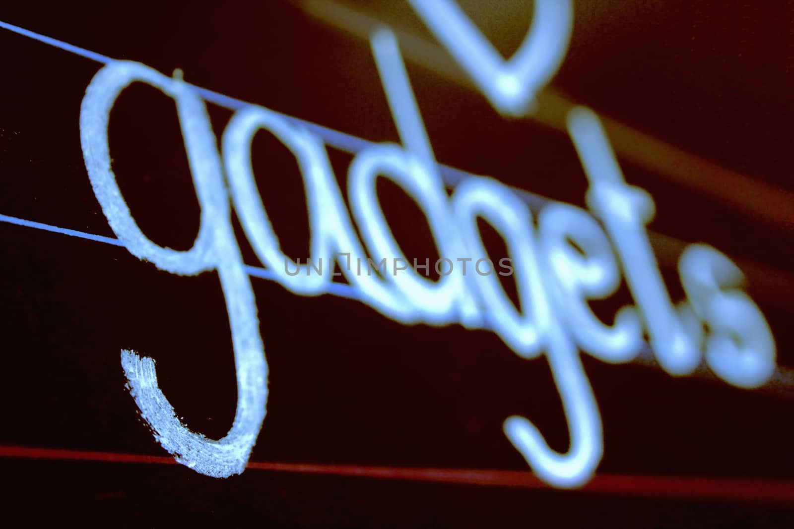 gadgets phrase handwritten on blackboard