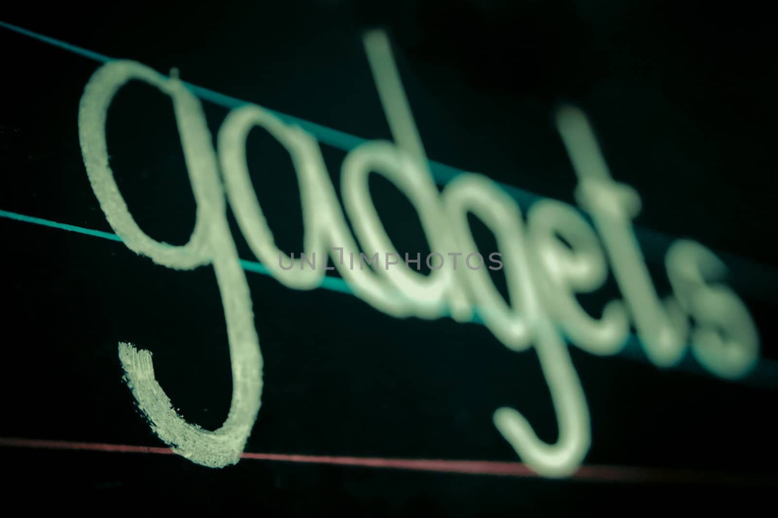 gadgets phrase handwritten on blackboard