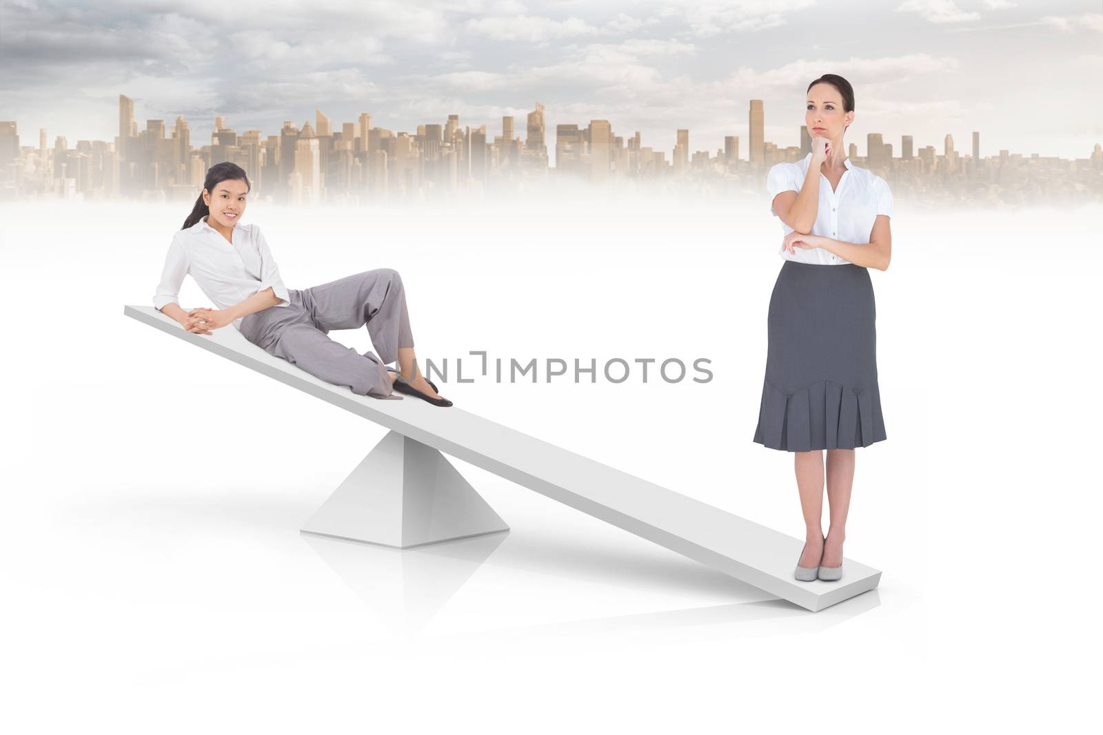 White scales weighing two businesswomen by Wavebreakmedia