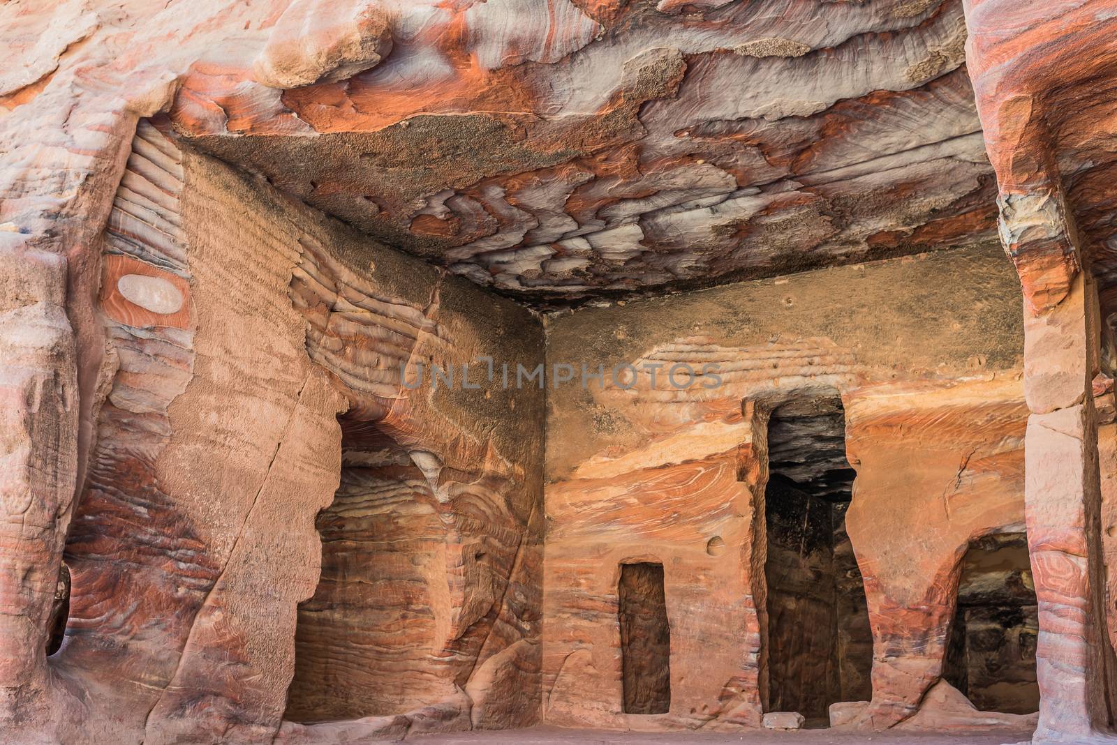 rocks caves in Nabatean city of  Petra Jordan by PIXSTILL