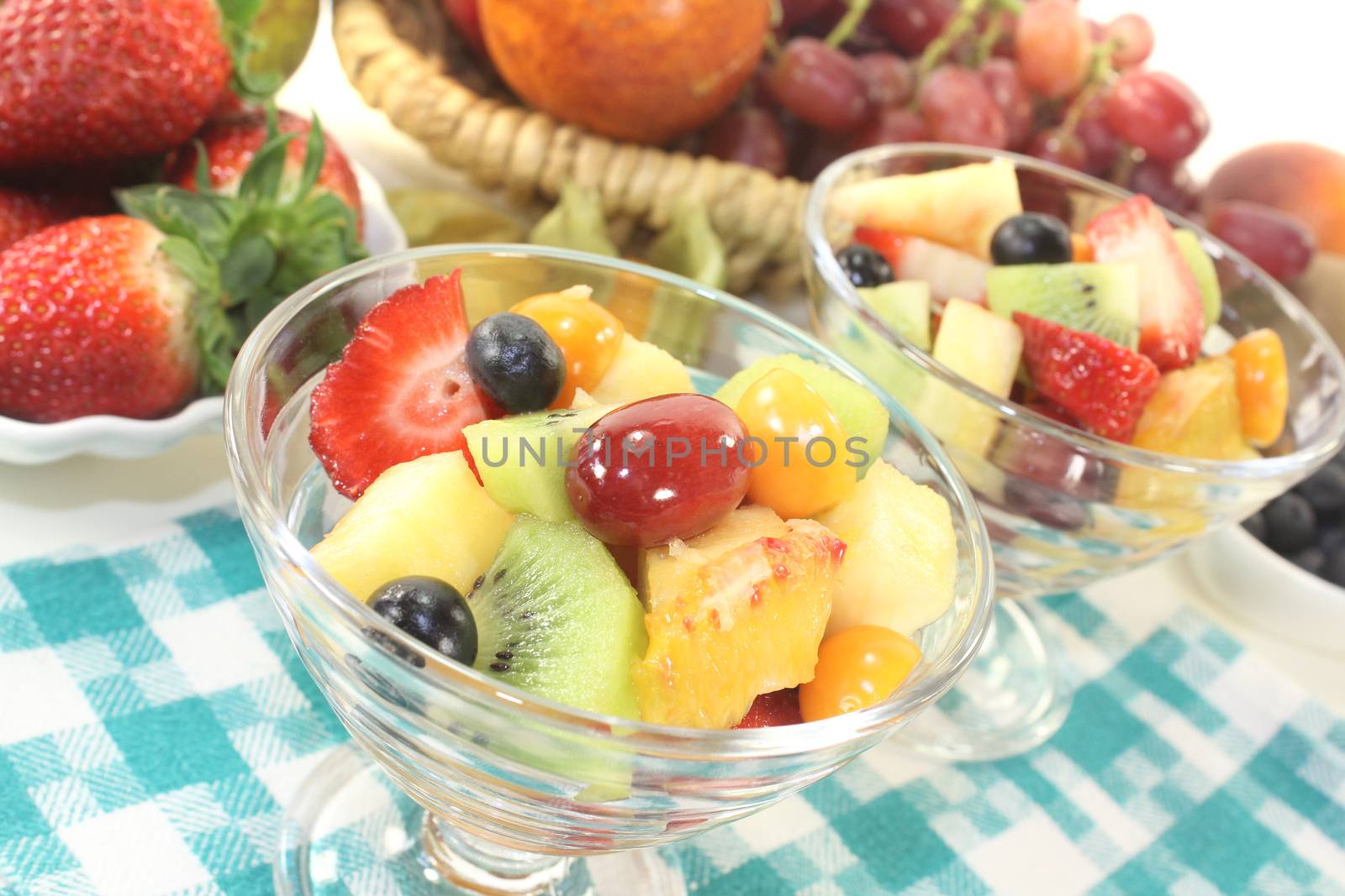 Fruit salad in a bowl on checkered napkin by discovery