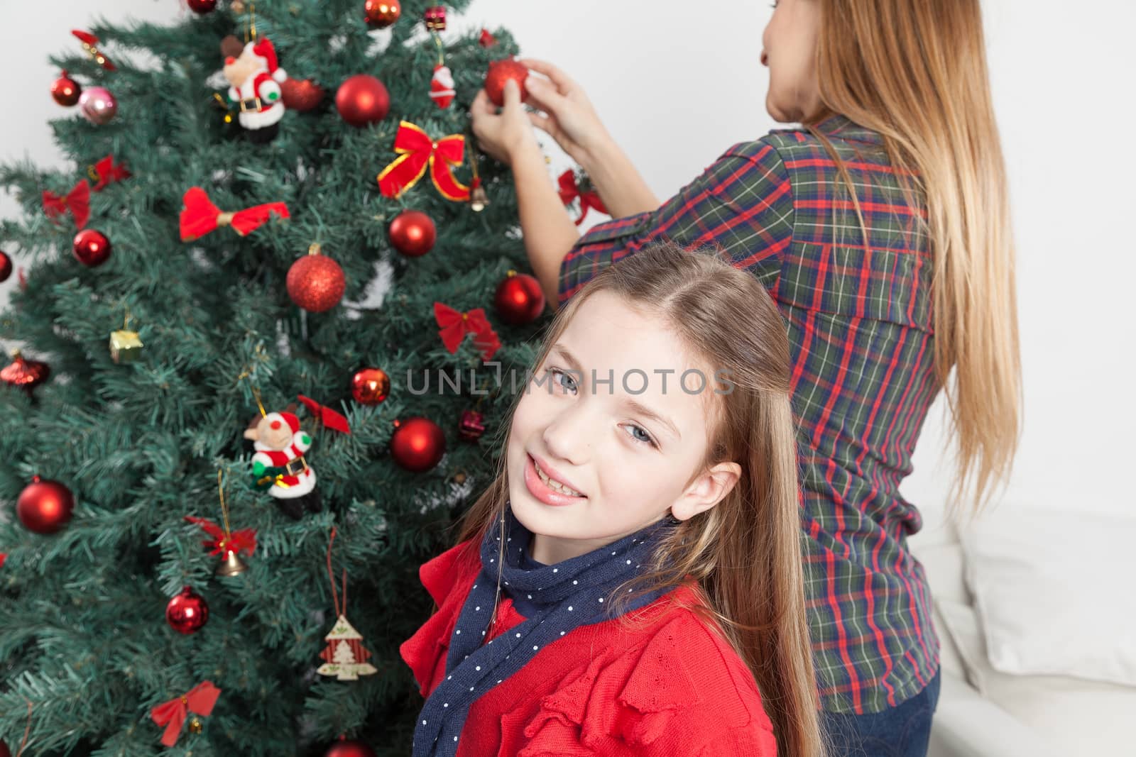 Girl beside the christmas tree by ifilms