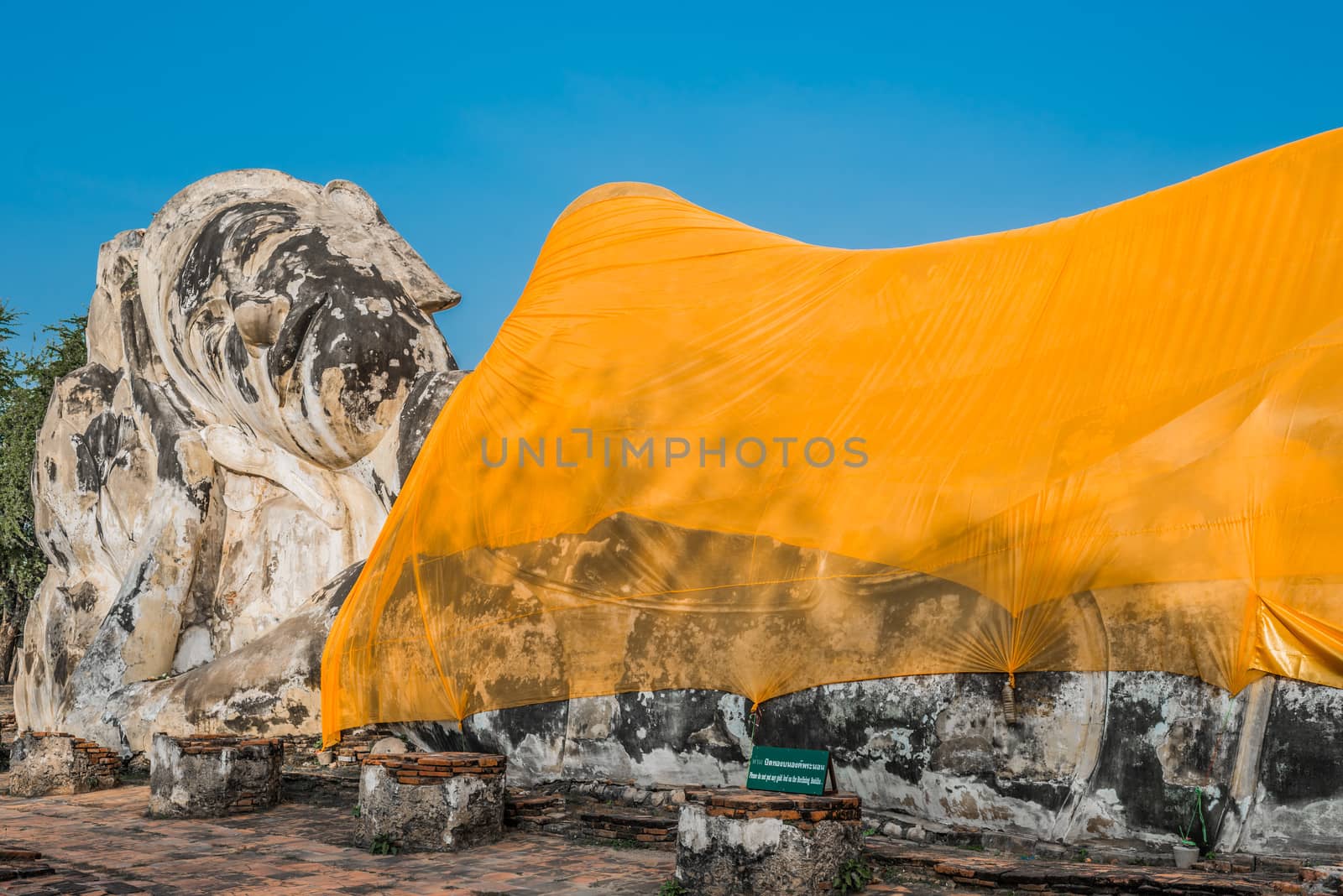 giant reclining buddha statue Wat Lokayasutharam Ayutthaya bangk by PIXSTILL