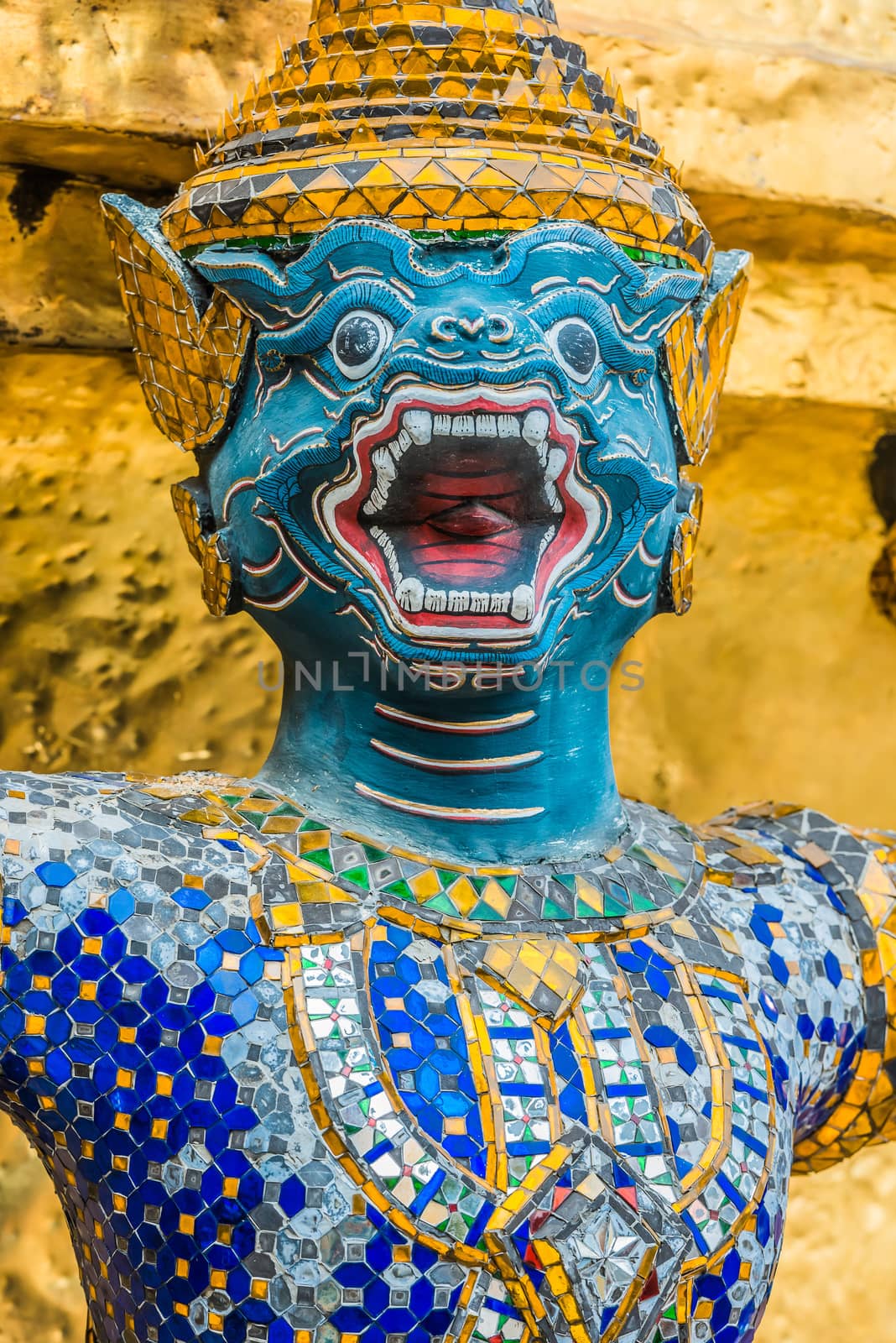 yaksha demon supporting golden chedi grand palace Bangkok Thailand