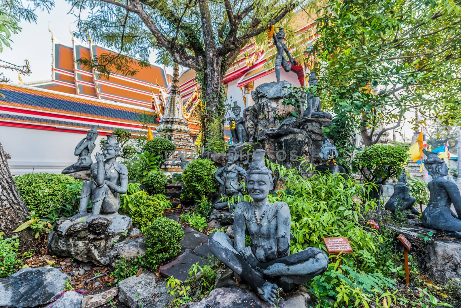 garden statues Wat Pho temple bangkok Thailand by PIXSTILL