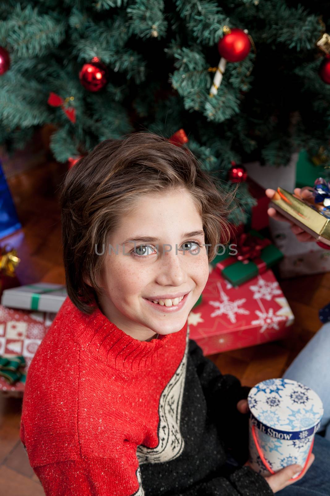 Happy boy opening the christmas gifts by ifilms