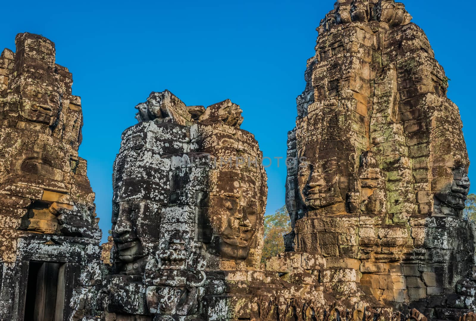 giant faces prasat bayon temple Angkor Thom Cambodia by PIXSTILL