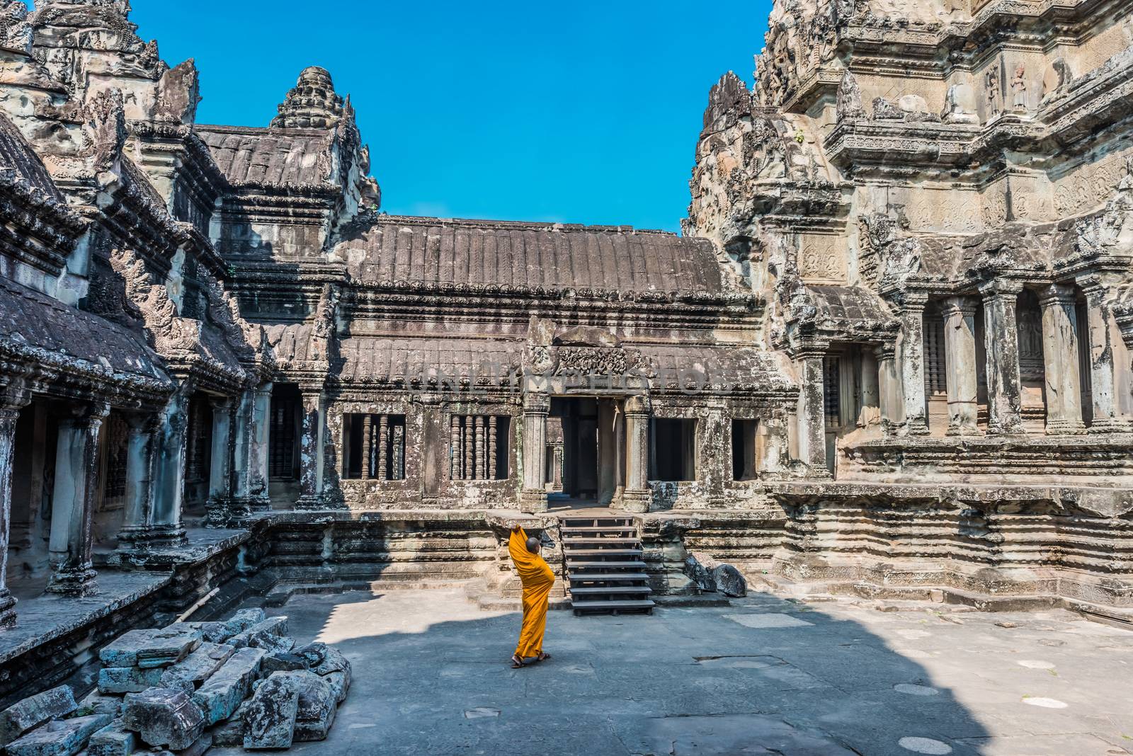 buddhist monk temple courtyard Angkor Wat Cambodia by PIXSTILL