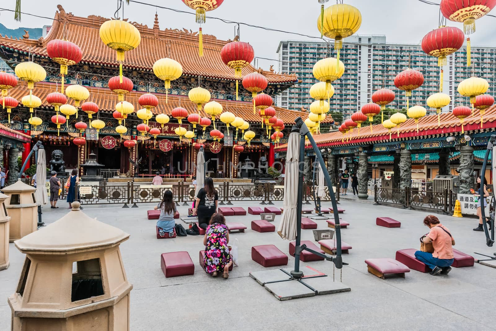 people praying Sik Sik Yuen Wong Tai Sin Temple Kowloon Hong Kon by PIXSTILL