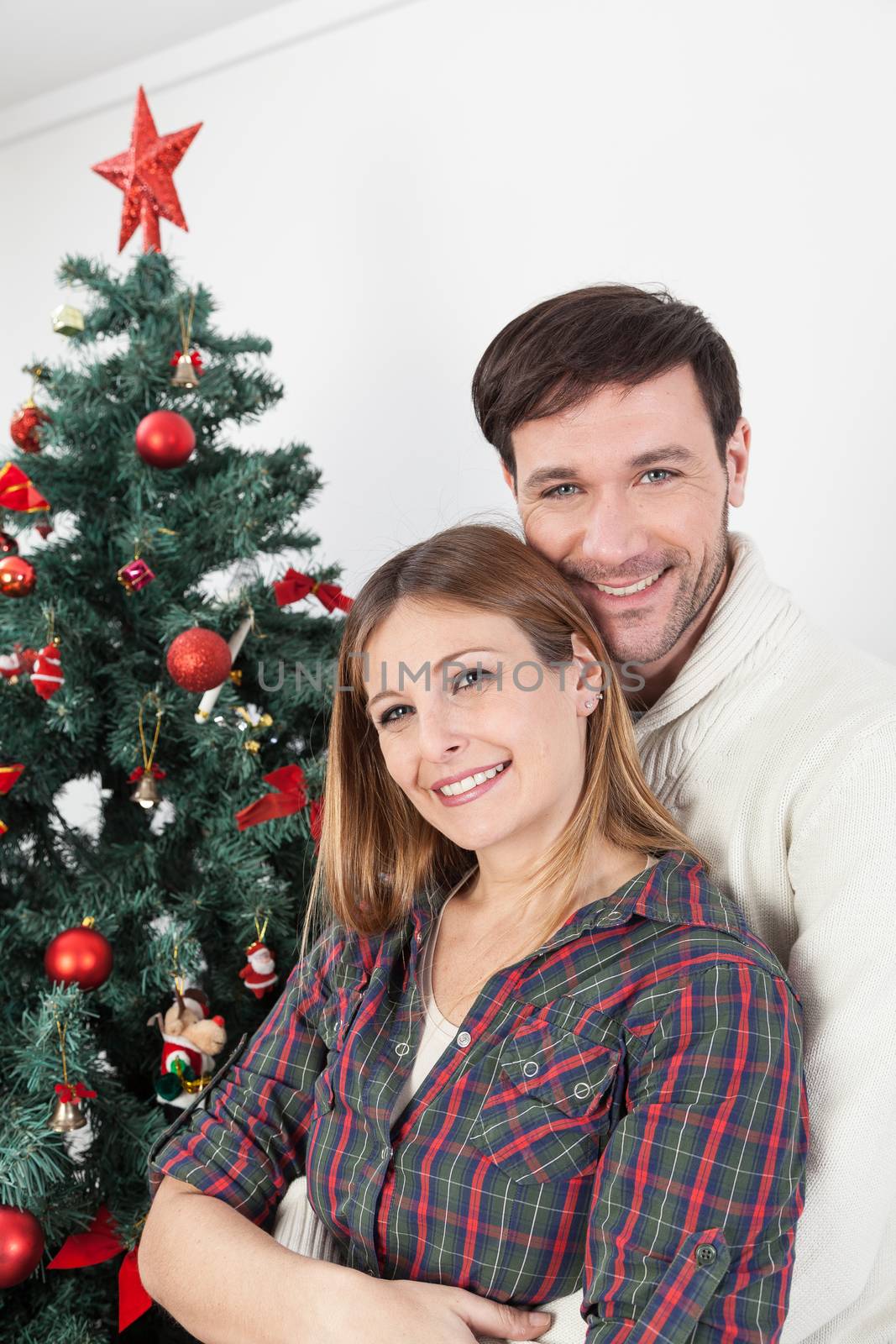 Happy couple smiling in christmas by ifilms