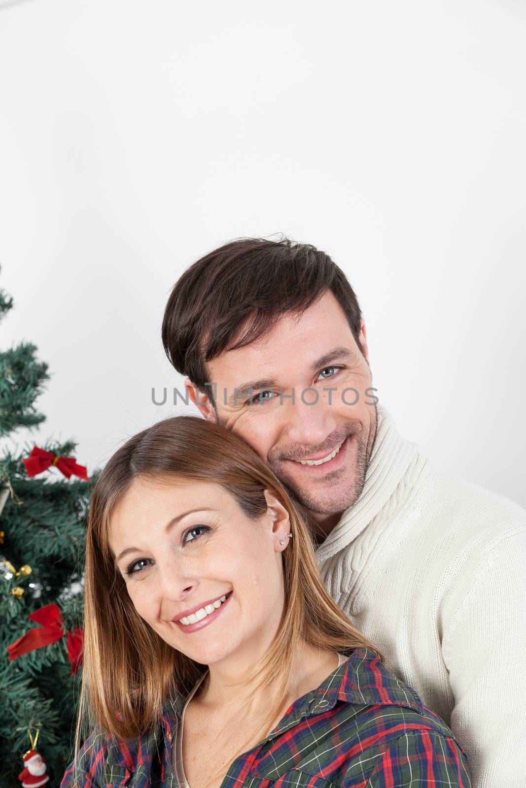Happy couple smiling in christmas by ifilms