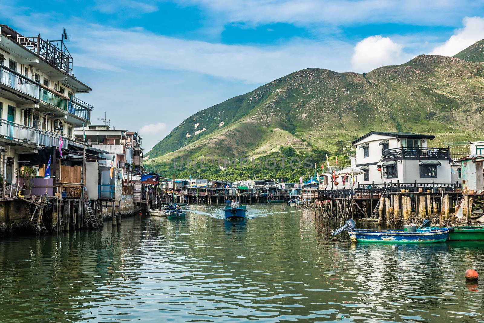 Tai O, Hong Kong, China- June 10, 2014: stilt houses and fishermen motorboats in Lantau island