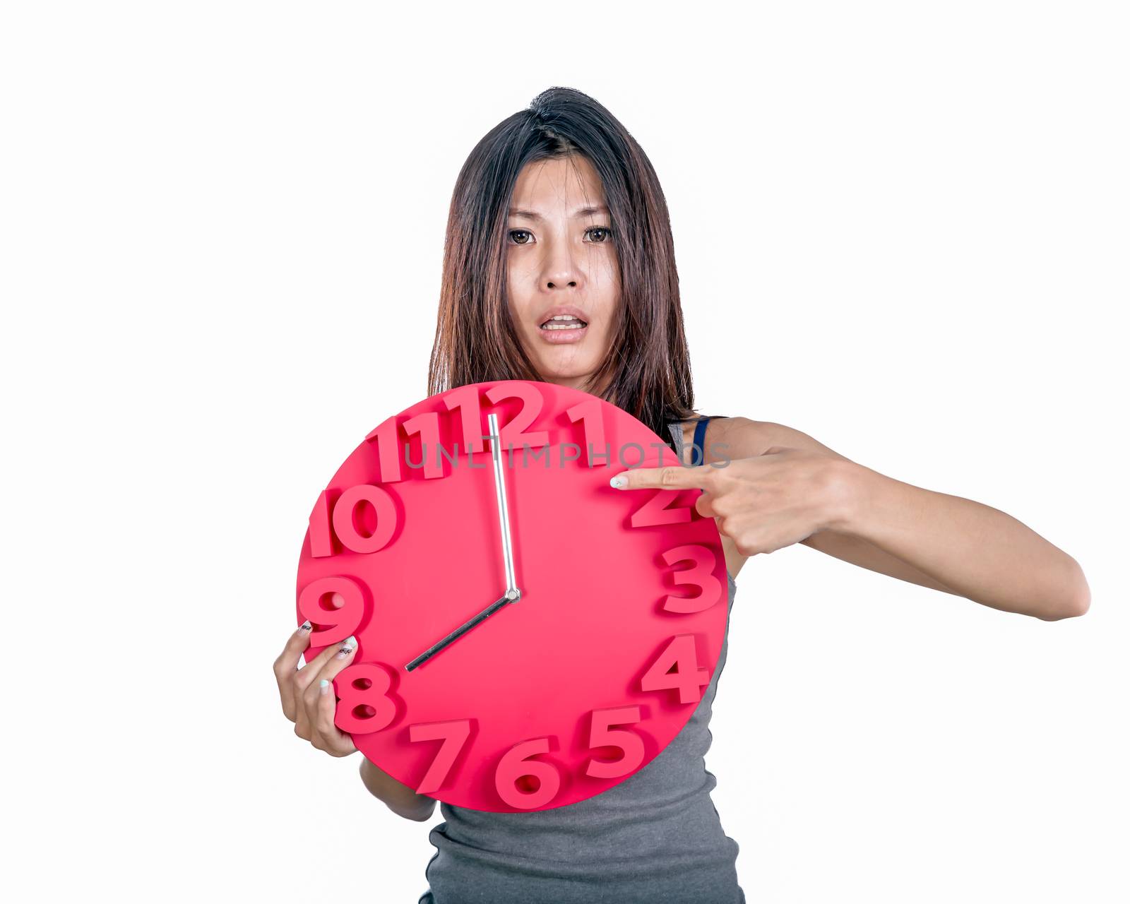Asian woman holding clock by imagesbykenny