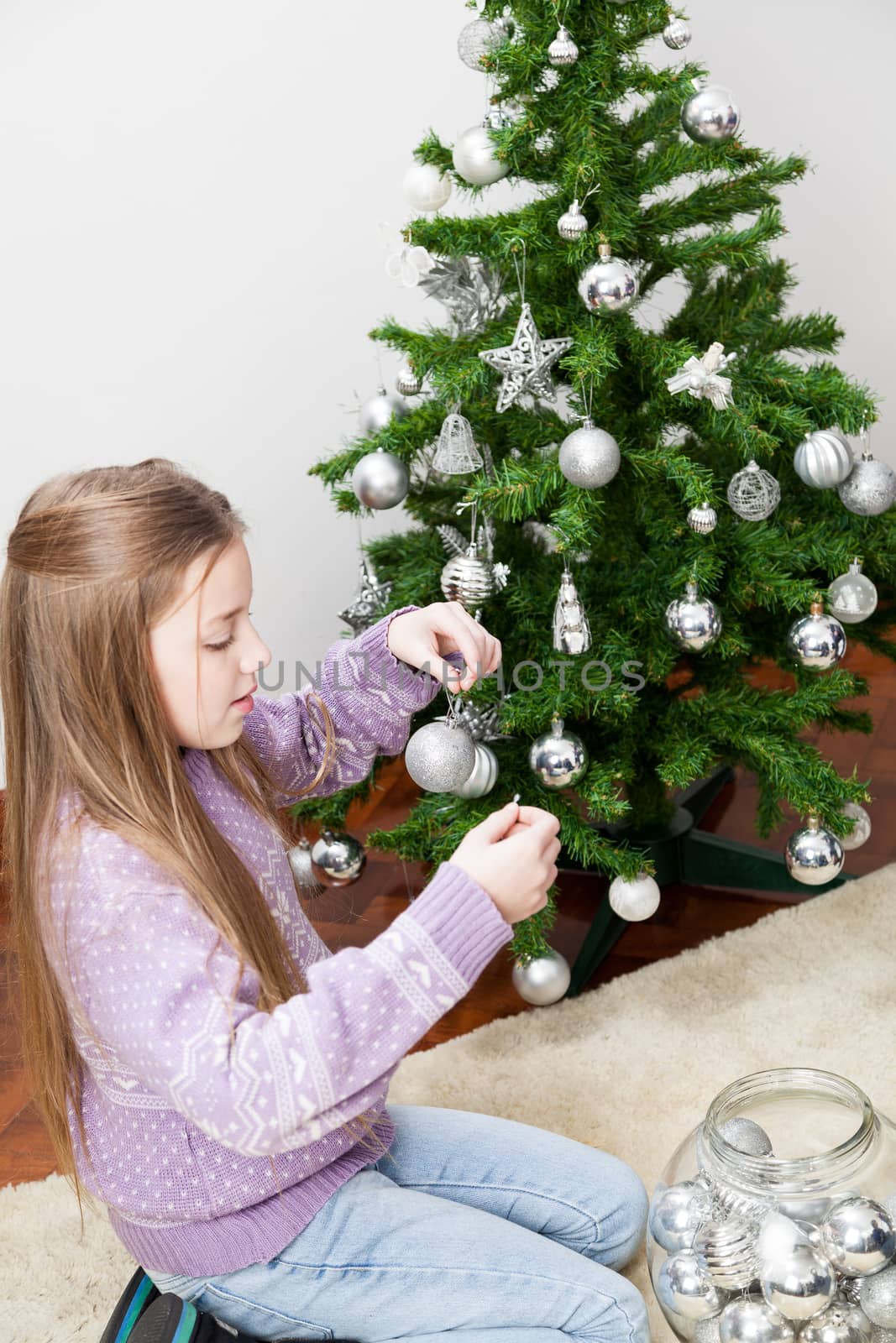 8-10, apartment, balls, bowl, carpet, caucasian, celebration, christmas, concentrated, cute, decoration, domestic, festive, festivity, girl, girls, hanging, hold, holding, holidays, home, house, leisure, life, lifestyle, little, living, merry, model, old, one, person, property, releases, room, santa, silver, time, tree, vertical, years
