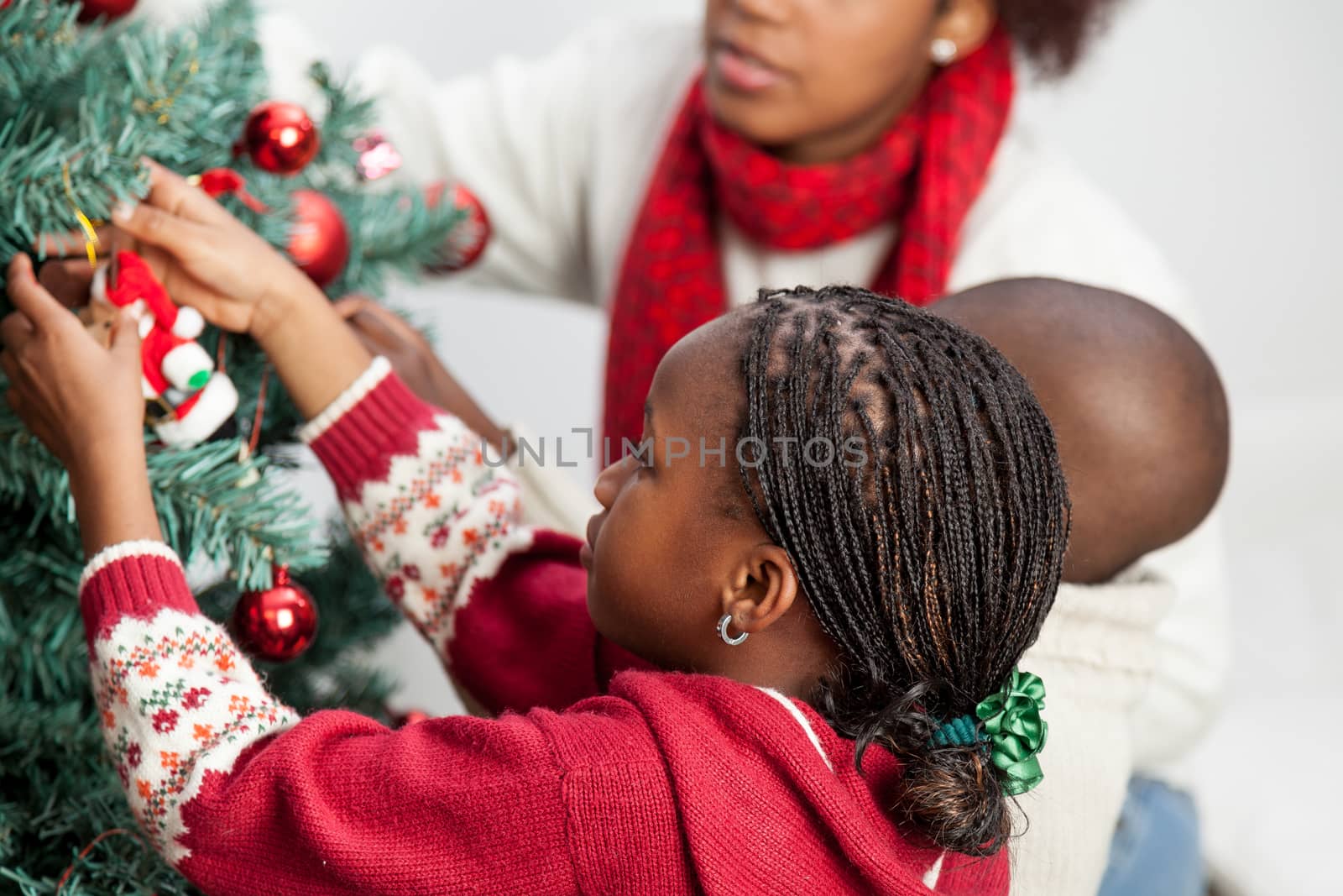 30-35, 4-6, adult, african, apartment, ball, black, celebration, cheerful, christmas, couple, cute, decoration, decorations, family, festive, girl, happy, home, horizontal, house, joyful, life, lifestyle, living, love, model, old, person, portrait, pretty, property, releases, room, time, together, tree, two, woman, years, young