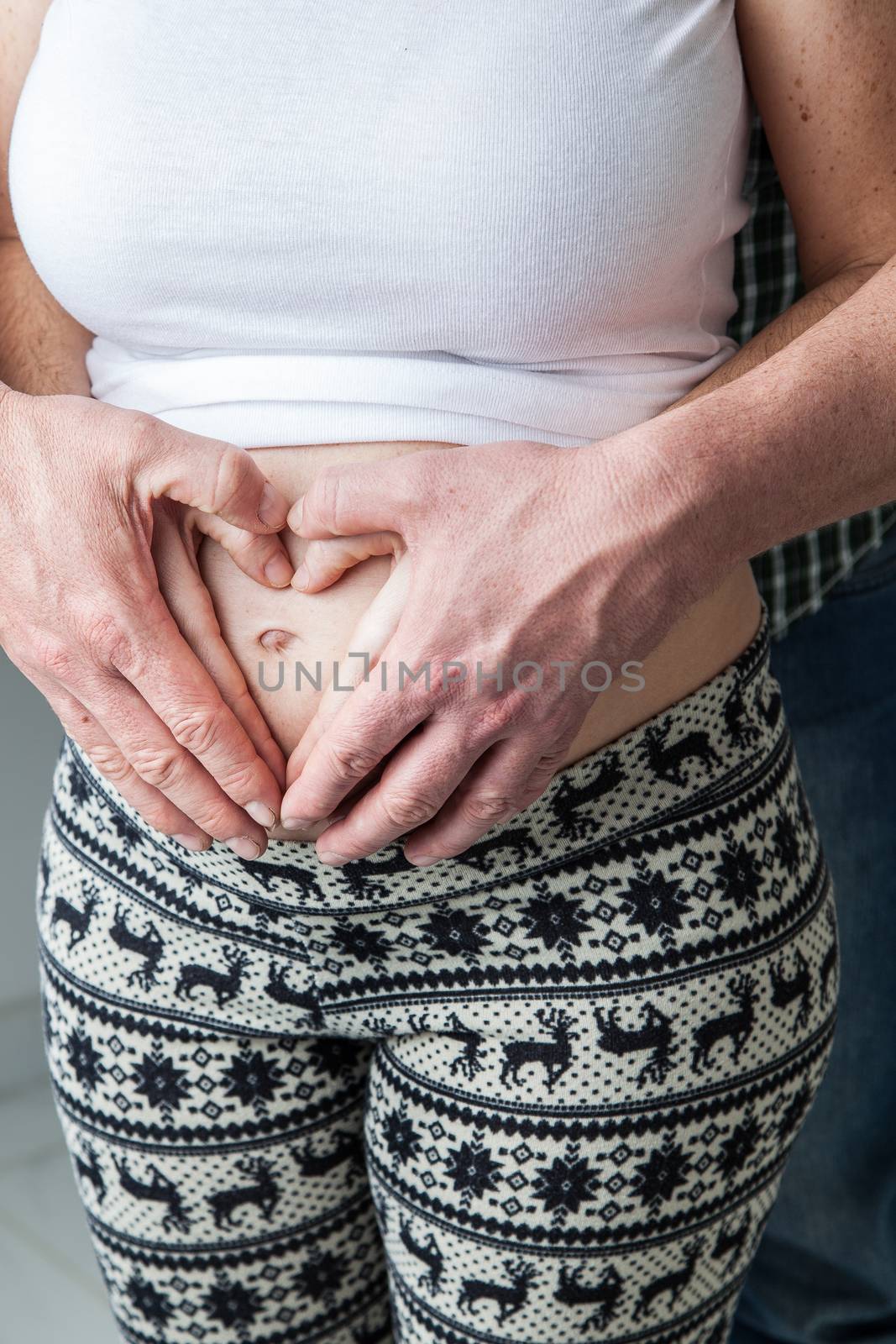 35-40, abdomen, adult, baby, belly, care, caucasian, couple, cute, detail, expectant, expecting, family, female, hand, hands, happy, health, healthy, heart, holding, human, life, love, male, man, maternal, maternity, model, mom, mother, motherhood, old, parent, parenthood, person, pregnancy, pregnant, property, release, shape, symbol, two, vertical, waiting, white, woman, years