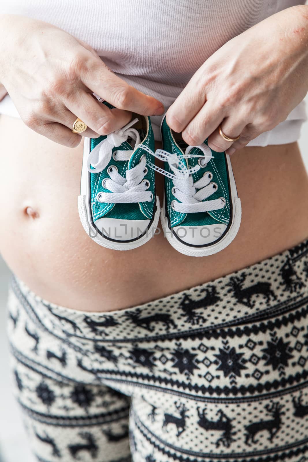 35-40, adult, baby, beautiful, belly, caucasian, crop, detail, expectant, expecting, family, female, hand, hands, happy, healthy, holding, human, lady, love, lover, maternity, model, mom, mother, motherhood, mum, old, one, parent, parenthood, person, pregnancy, pregnant, property, release, slipper, standing, stomach, vertical, white, woman, years