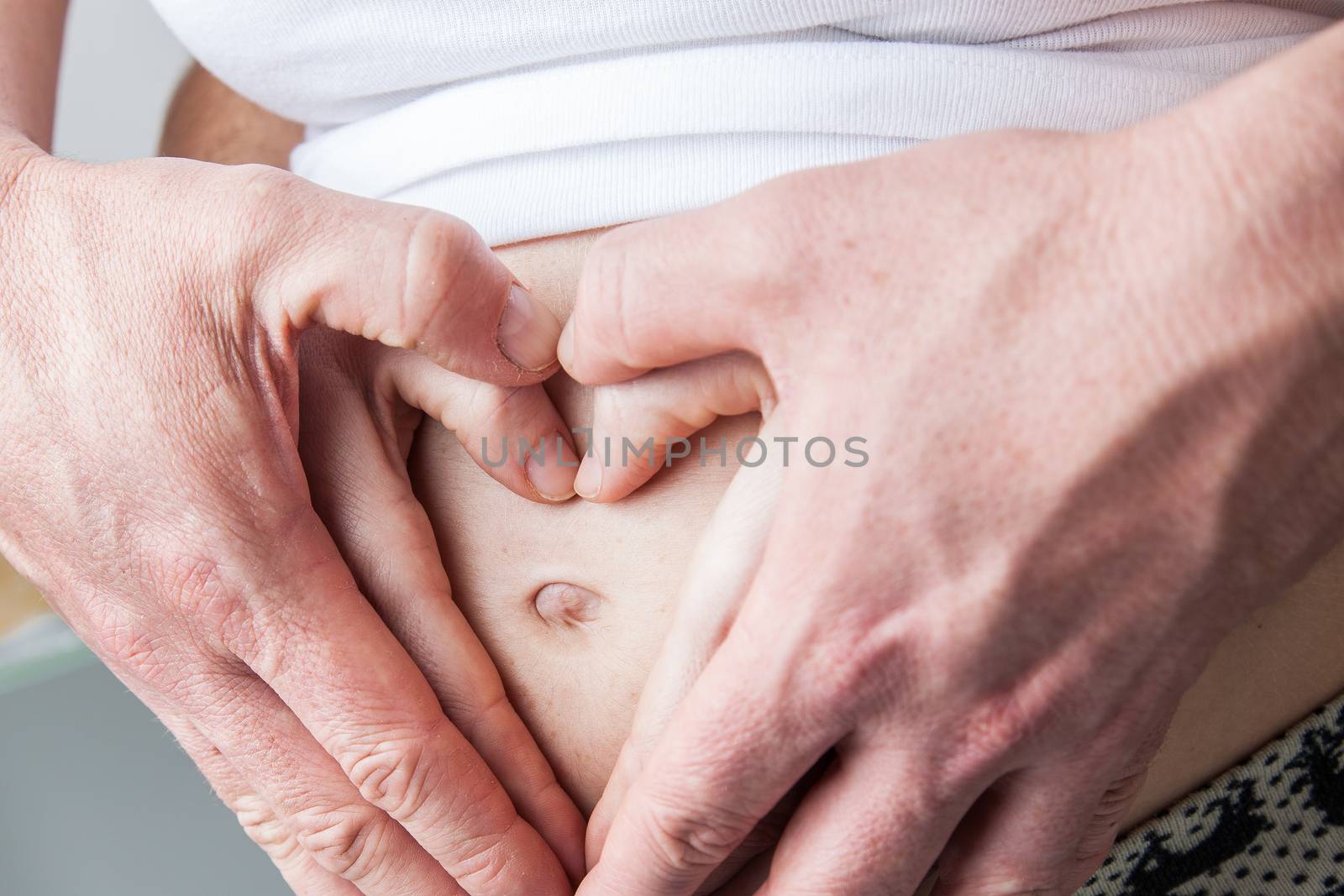 35-40, abdomen, adult, baby, belly, care, caucasian, couple, cute, detail, expectant, expecting, family, female, hand, hands, happy, health, healthy, heart, holding, horizontal, human, life, love, male, man, maternal, maternity, model, mom, mother, motherhood, old, parent, parenthood, person, pregnancy, pregnant, property, release, shape, symbol, two, waiting, white, woman, years