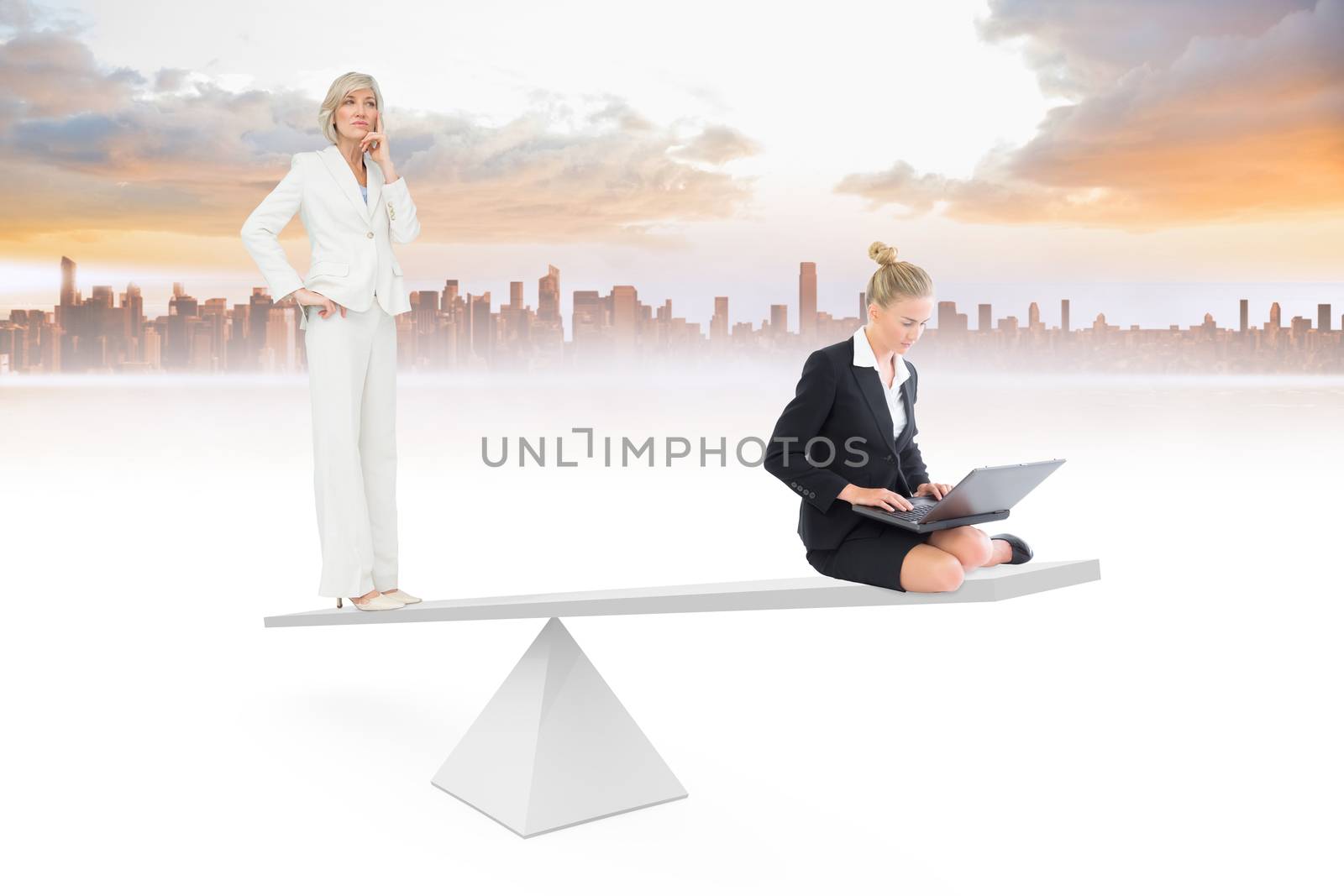 White scales weighing two businesswomen by Wavebreakmedia