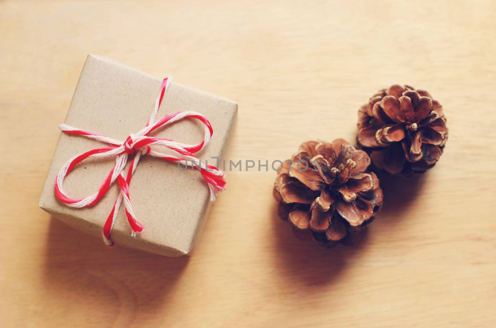 Handmade gift box and pine cone with retro filter effect
