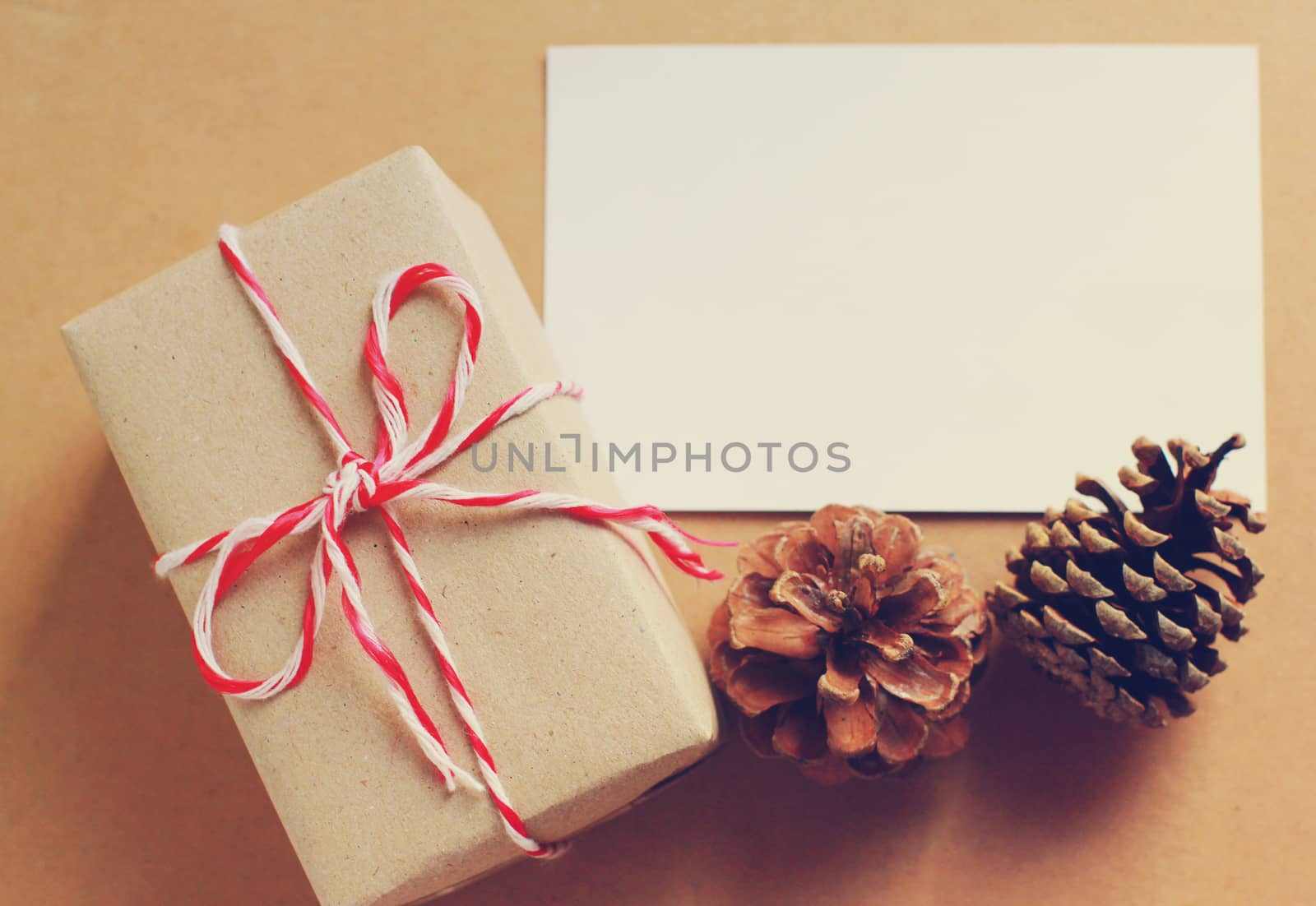 Handmade gift box and blank note paper with pine cone, retro filter effect